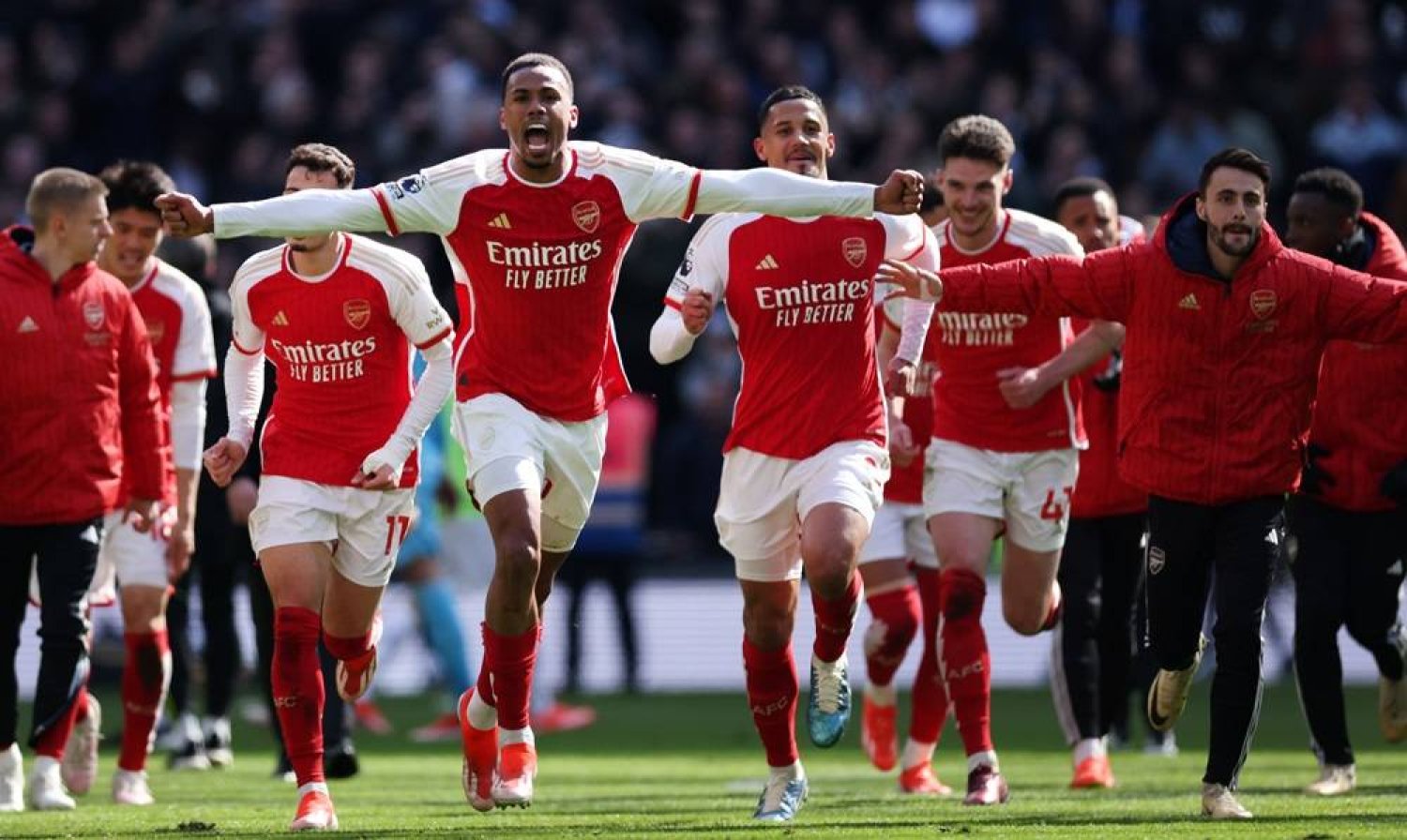 Gabriel (L) of Arsenal and his teammates celebrate their 3-2 win after the English Premier League soccer match between Tottenham Hotspur against Arsenal FC in London, Britain, 28 April 2024. (EPA)