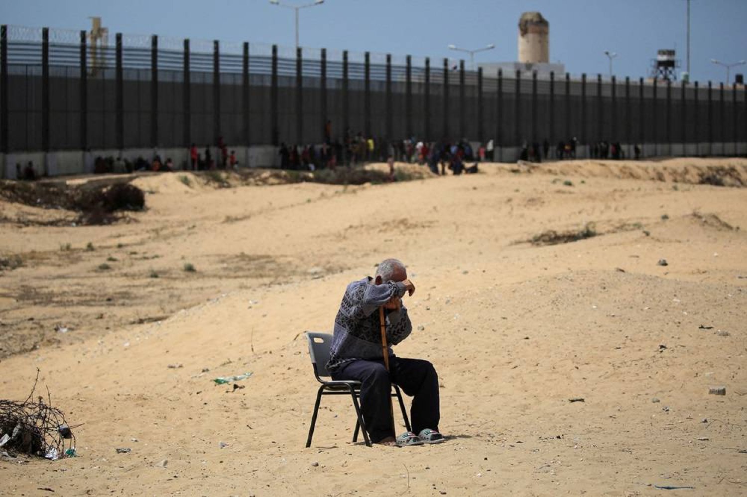 A man sits in a camp for displaced people in Rafah in the southern Gaza Strip by the border with Egypt on April 28, 2024, amid the ongoing conflict between Israel and Hamas. (AFP)