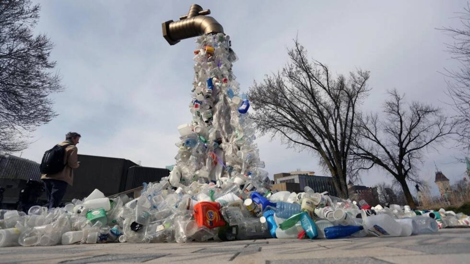 A sculpture titled "Giant Plastic Tap" by Canadian artist Benjamin Von Wong is displayed outside the fourth session of the UN Intergovernmental Negotiating Committee on Plastic Pollution that has wrapped up in Ottawa, Canada. Dave Chan / AFP