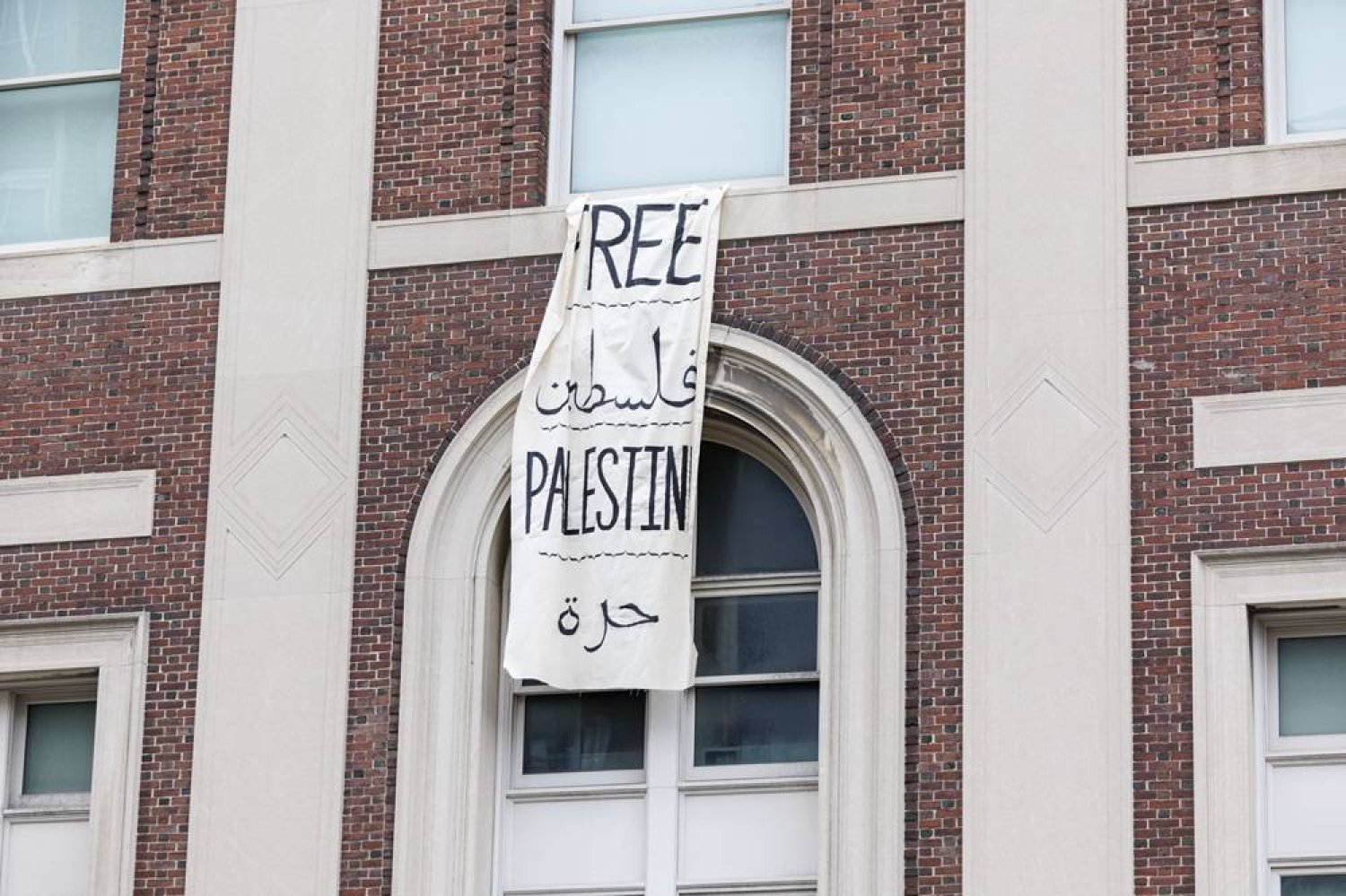 A "Free Palestine" sign hangs from a window following pro-Palestine students' takeover of Hamilton Hall, on Columbia University's campus in New York, New York, USA, 30 April 2024. (EPA)