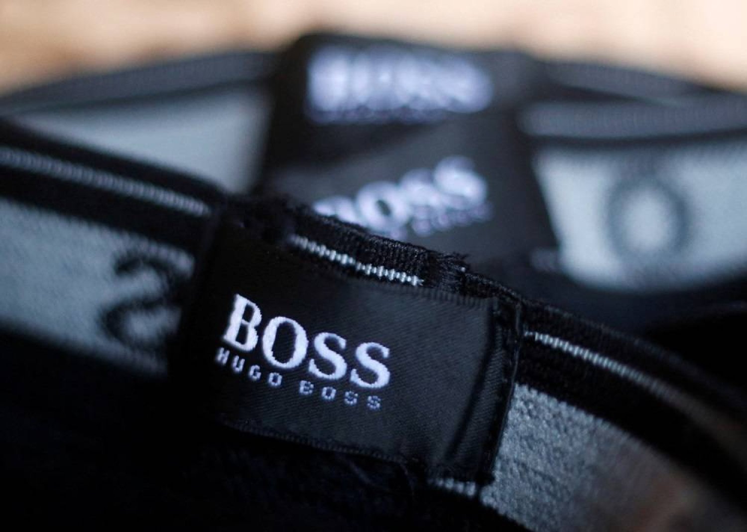 The logo of German fashion house Hugo Boss is seen on a clothing label at their outlet store in Mezingen near Stuttgart October 29, 2013. (Reuters)