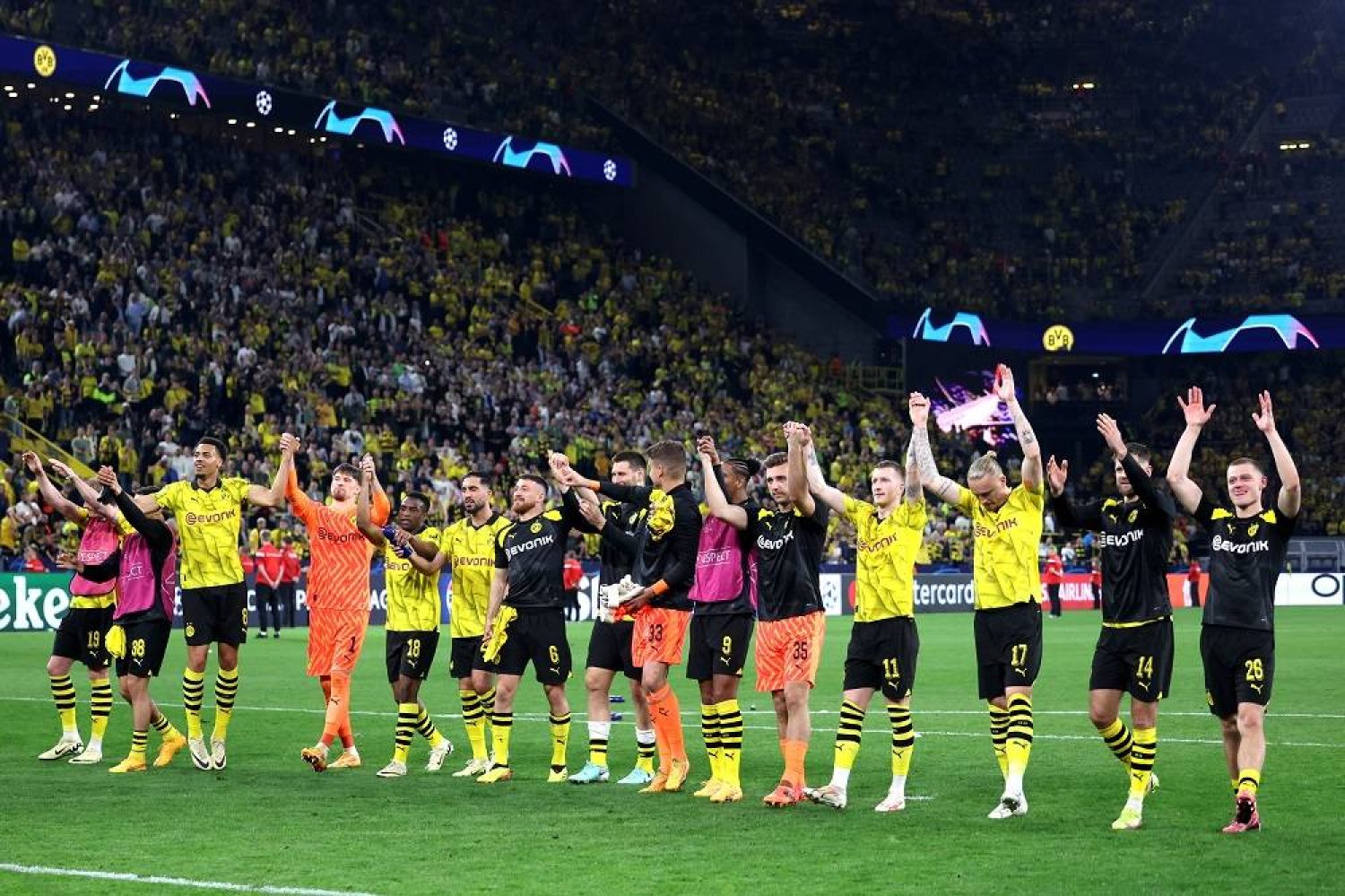 Dortmund players celebrate with their supporters after winning the UEFA Champions League semi final, 1st leg match between Borussia Dortmund and Paris St Germain in Dortmund, Germany, 01 May 2024. (EPA)