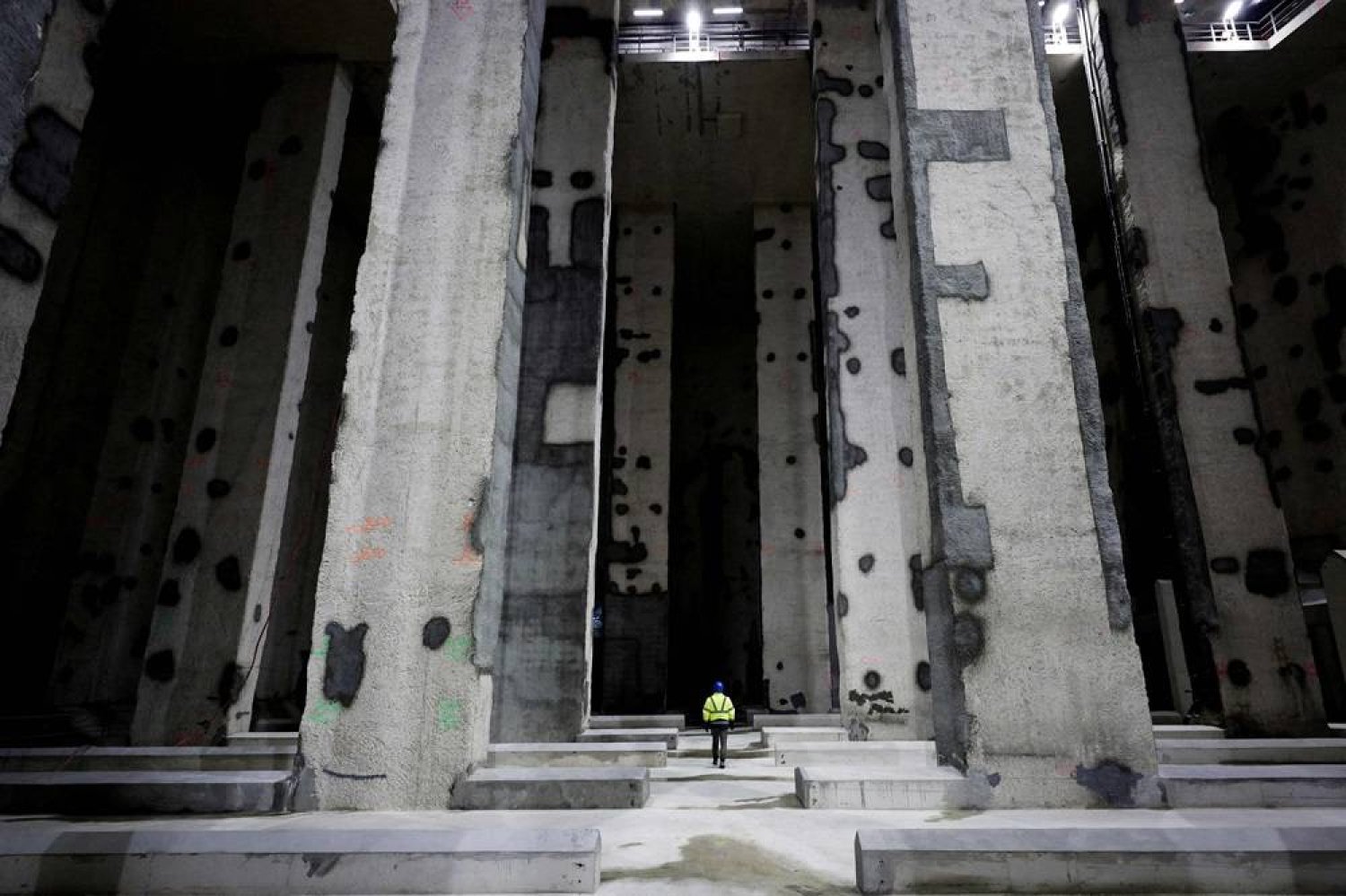 A worker walks inside the Austerlitz wastewater and rainwater storage basin, which is intended, among other things, to make the Seine swimmable during the Paris 2024 Olympic Games, in Paris, on May 2, 2024. (AFP)