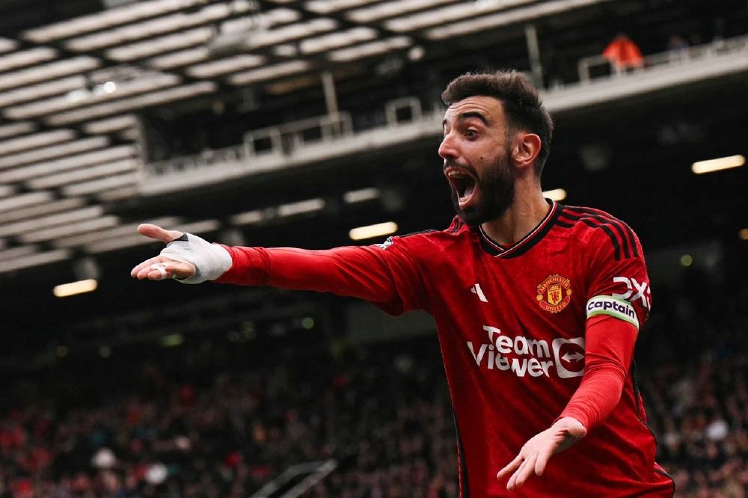 Manchester United's Portuguese midfielder #08 Bruno Fernandes reacts as he appeals for a penalty during the English Premier League football match between Manchester United and Burnley at Old Trafford in Manchester, northwest England, on April 27, 2024. (AFP) 