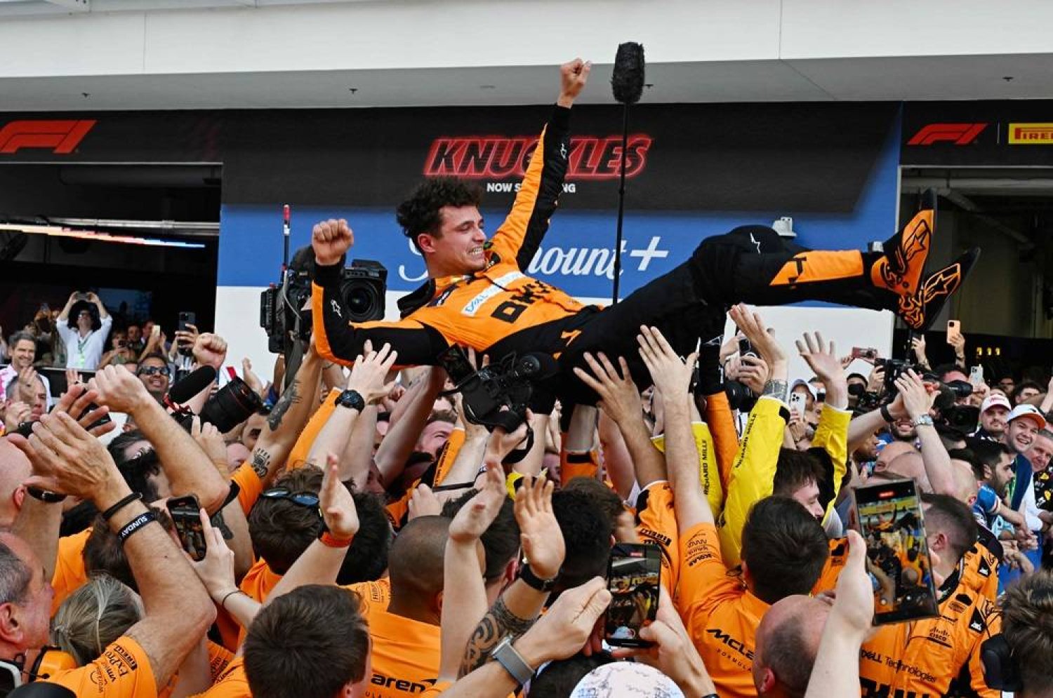 McLaren's British driver Lando Norris is tossed in the air as his team celebrates his victory in the 2024 Miami Formula One Grand Prix at Miami International Autodrome in Miami Gardens, Florida, on May 5, 2024. (AFP) 