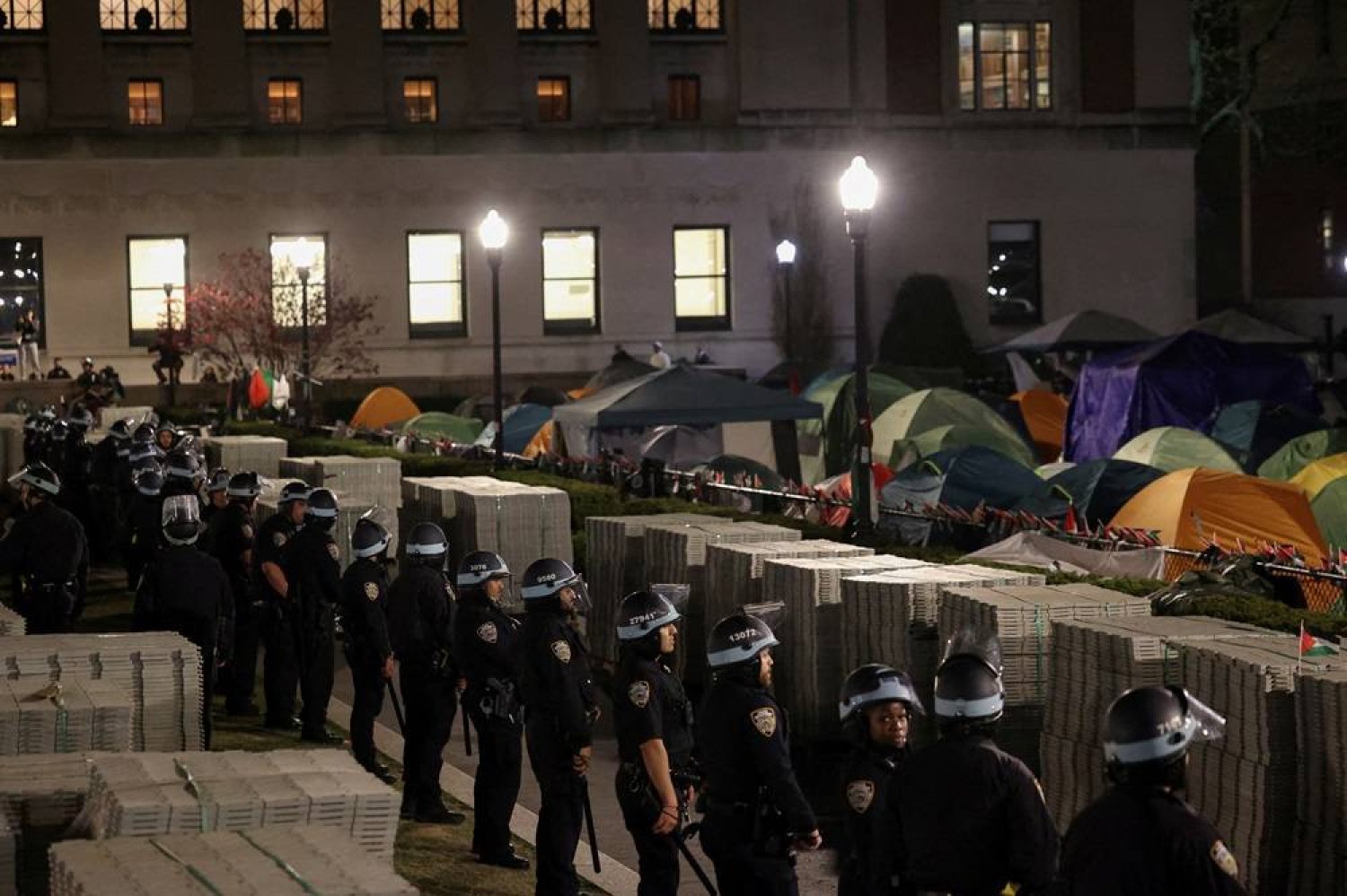 Police stand guard near an encampment of protesters supporting Palestinians on the grounds of Columbia University, during the ongoing conflict between Israel and the Palestinian group Hamas, in New York City, US, April 30, 2024. (Reuters)