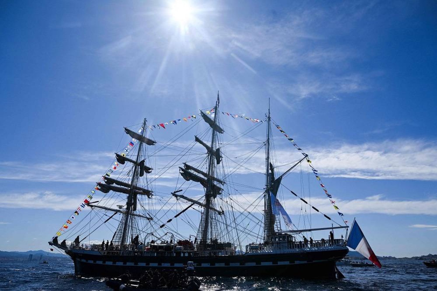 French 19th-century three-masted barque Belem sails in the bay of Marseille, in the Mediterranean Sea, on May 8, 2024, before landing with the Olympic torch, ahead of the Paris 2024 Olympic and Paralympic Games. (AFP)