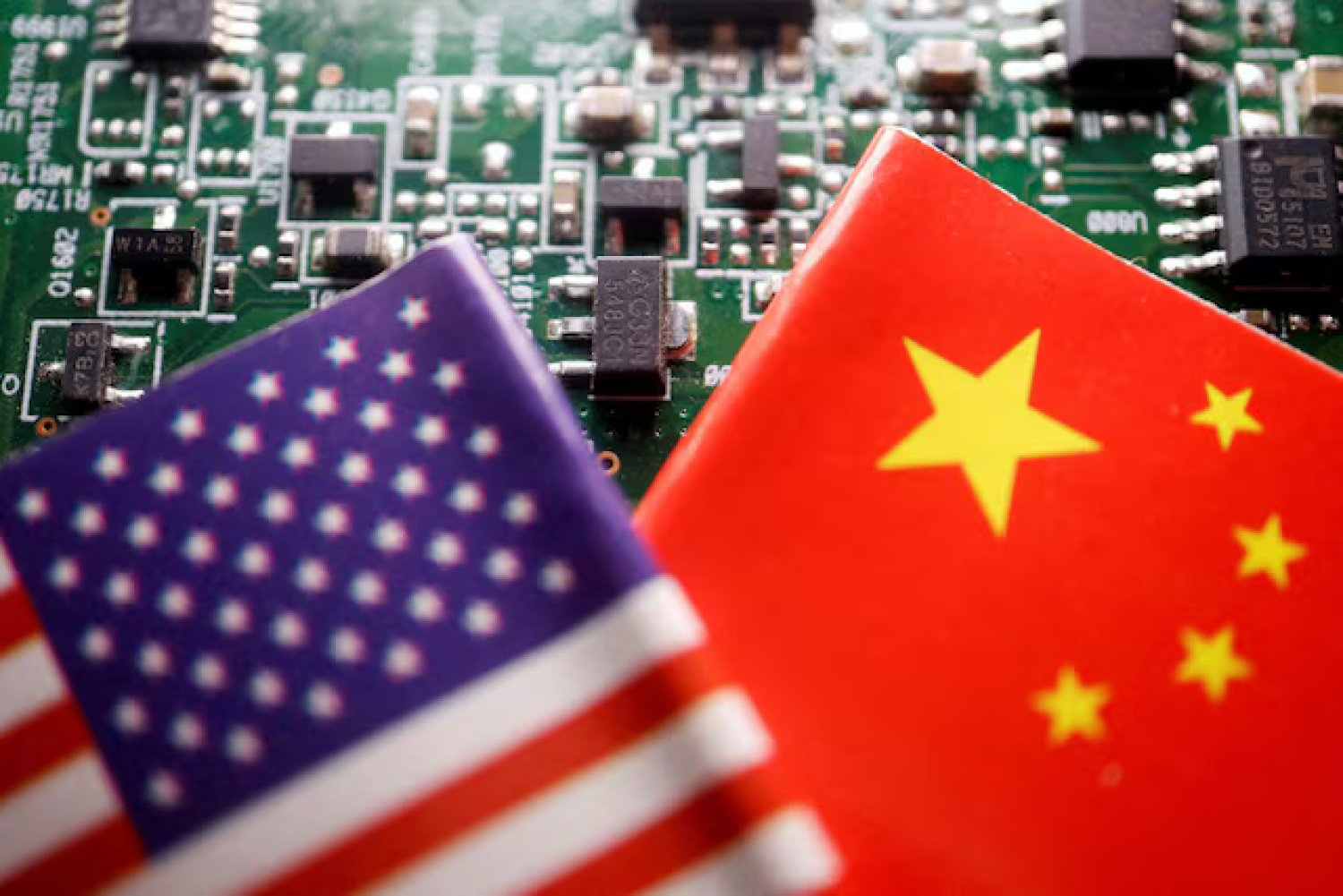 Flags of China and US are displayed on a printed circuit board with semiconductor chips, in this illustration picture taken February 17, 2023. REUTERS/Florence Lo/Illustration/File Photo Purchase Licensing Rights