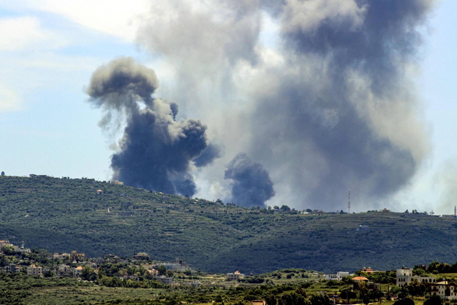 Smoke plumes billow from the site of an Israeli airstrike on the outskirts of the village of Marwahin in southern Lebanon near the border with Israel on May 8, 2024. (Photo by KAWNAT HAJU / AFP)