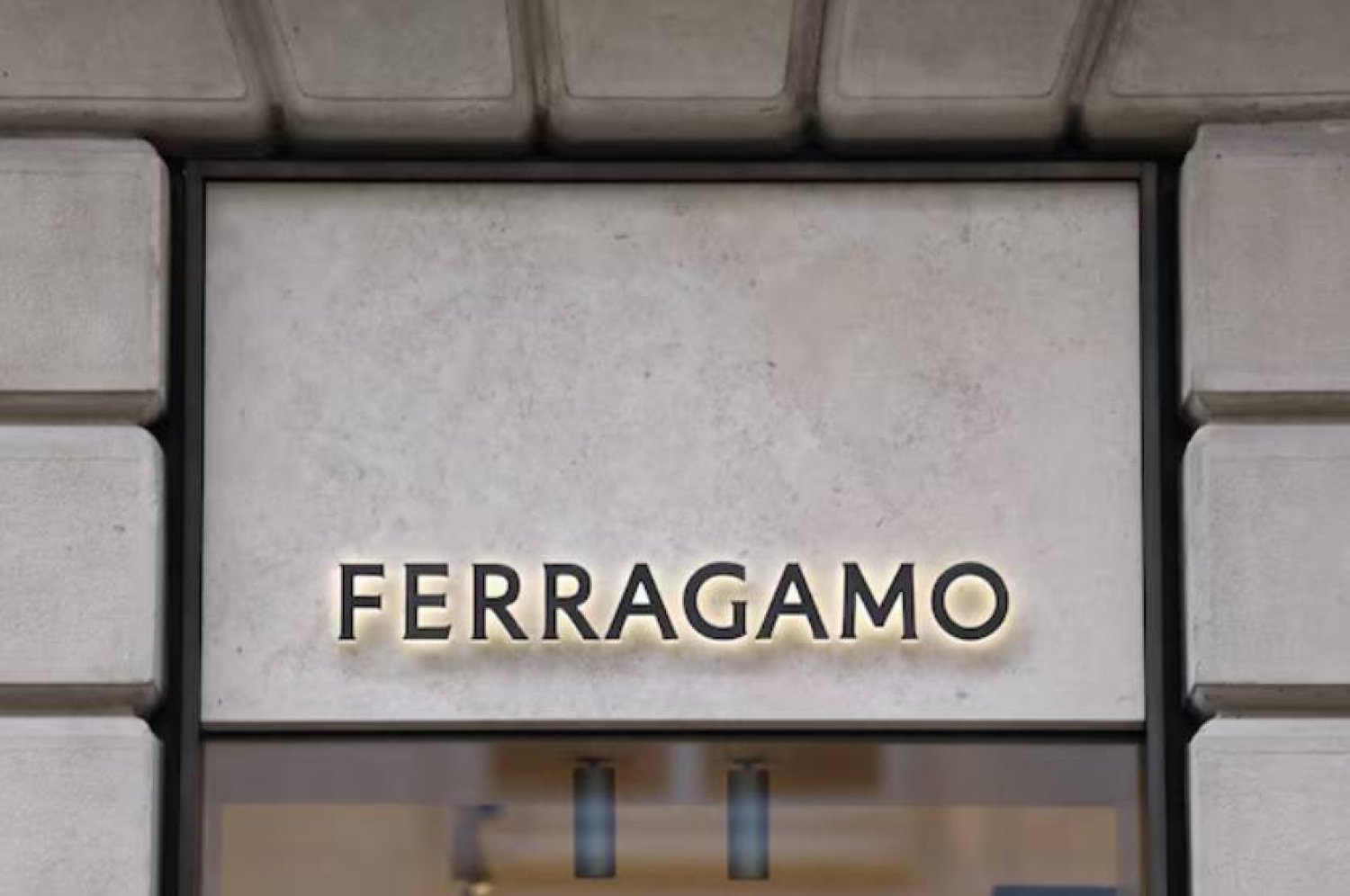 A view of Italian luxury fashion house Salvatore Ferragamo's logo at a store in Milan, Italy, March 6, 2024. REUTERS/Claudia Greco