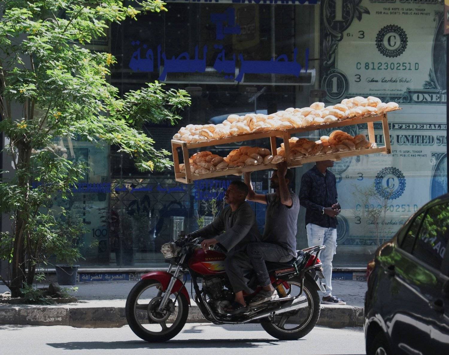 A man selling bread on a street in the center of the Egyptian capital, Cairo (Reuters)