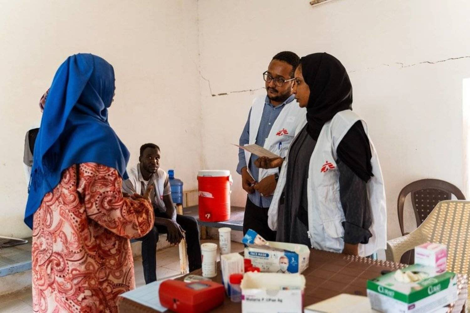 Health workers from Doctors Without Borders (MSF) welcome patients in Sudan
