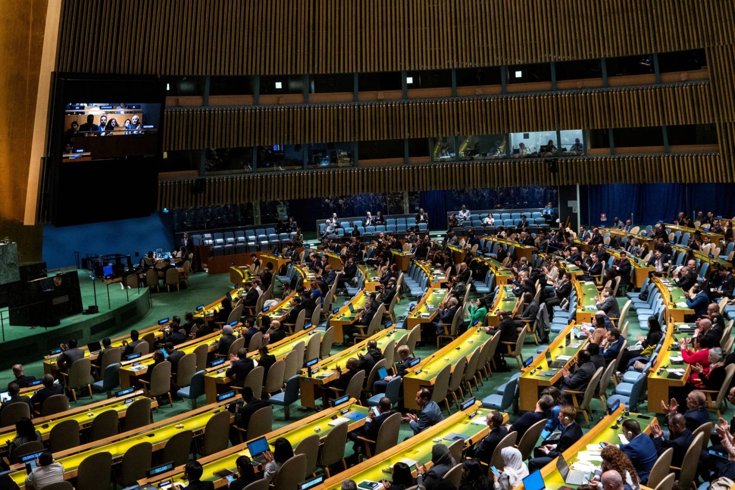 FILE PHOTO: Delegates react to the voting results during the United Nations General Assembly vote on a draft resolution that would recognize the Palestinians as qualified to become a full UN member, in New York City, US May 10, 2024. REUTERS/Eduardo Munoz/File Photo