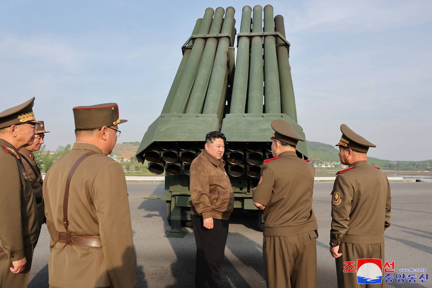 A photo released by the official North Korean Central News Agency (KCNA) shows North Korean leader Kim Jong Un (C) overseeing the test fire of the 240mm multiple rocket launcher system in an undisclosed location in North Korea, 10 May 2024 (issued 11 May 2024). EPA/KCNA   