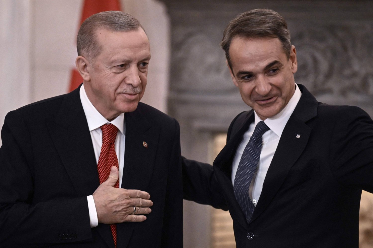 President Recep Tayyip Erdoğan (L) and Greek Prime Minister Kyriakos Mitsotakis leave after speaking to the press following their meeting in Athens during Erdogan's official visit to Greece, Dec. 7, 2023. (AFP Photo)

