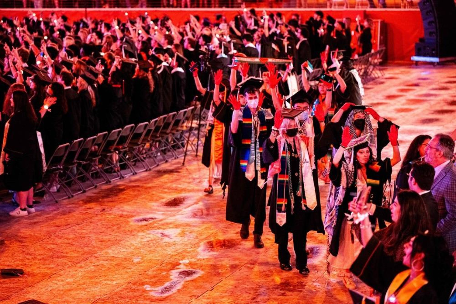 Graduate students walk out of commencement in protest against the war in Gaza at the DKR-Texas Memorial Stadium on May 11, 2024 in Austin, Texas. (Getty Images/AFP)