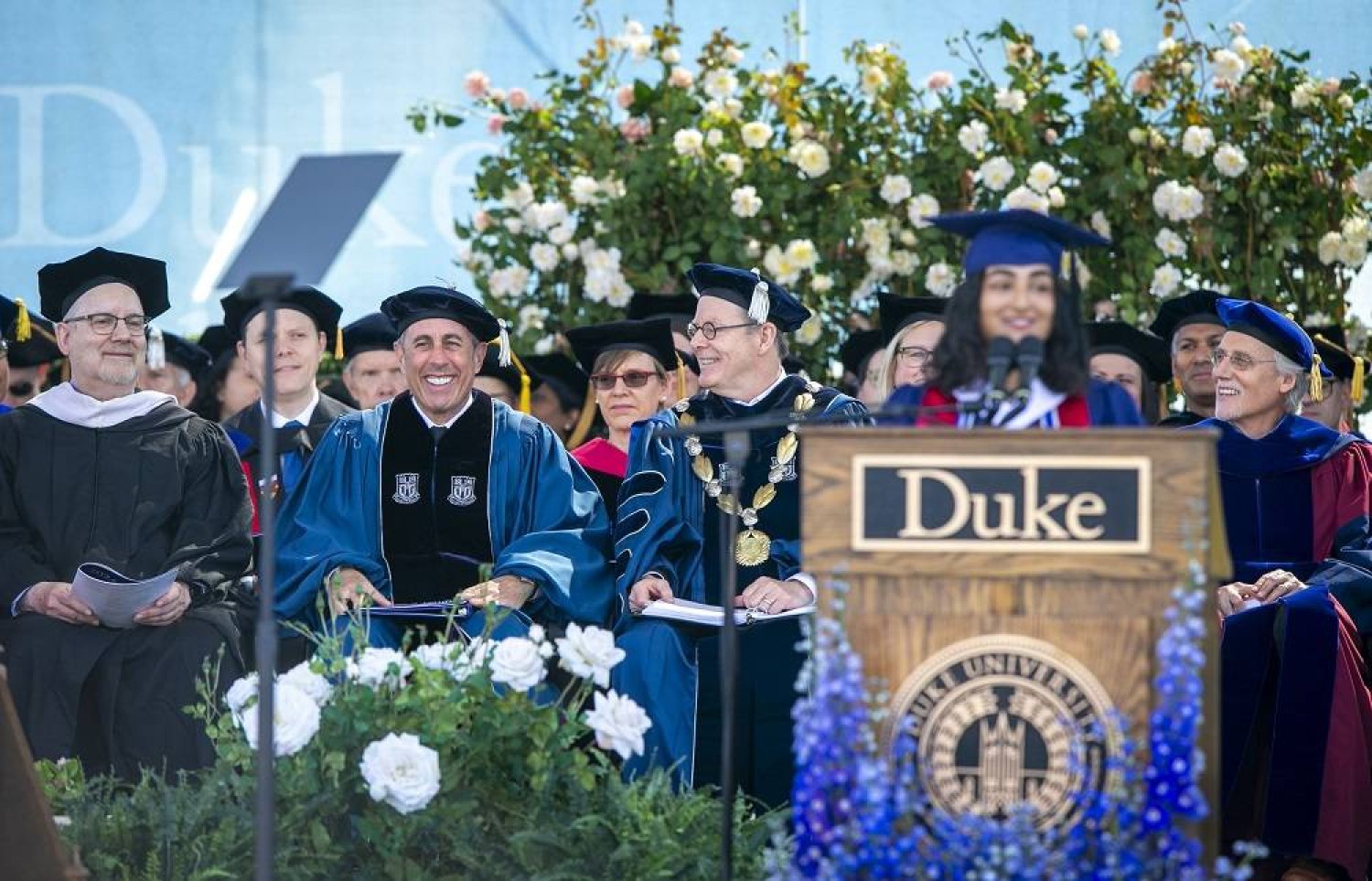 This photo provided by Duke University shows commencement speaker Jerry Seinfeld, front row second from left, on stage during the school's graduation ceremony, Sunday, May 12, 2024, in Durham, NC. (Duke University via AP)