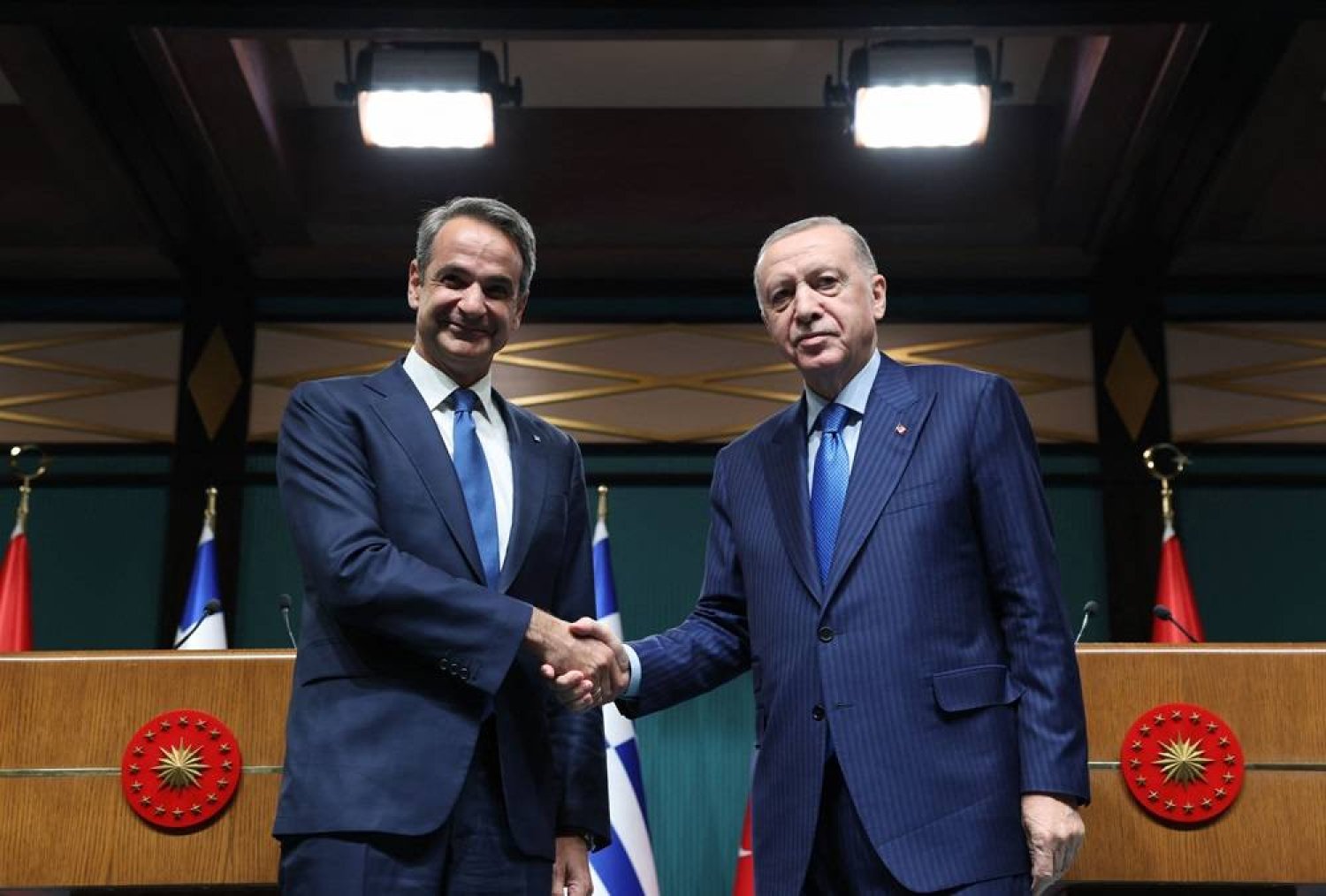 In this handout photograph taken and released by the Turkish Presidency Press Service on May 13, 2024, Türkiye’s President Recep Tayyip Erdogan (R) shakes hands with Greek Prime Minister Kyriakos Mitsotakis at the end of their joint press conference in Ankara. (Photo by Turkish Presidental Press Service / AFP) 